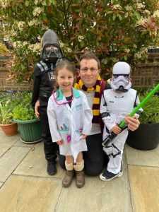 Image of Dino Luciano in Harry Potter outfit with his children in fancy dress for a charity run